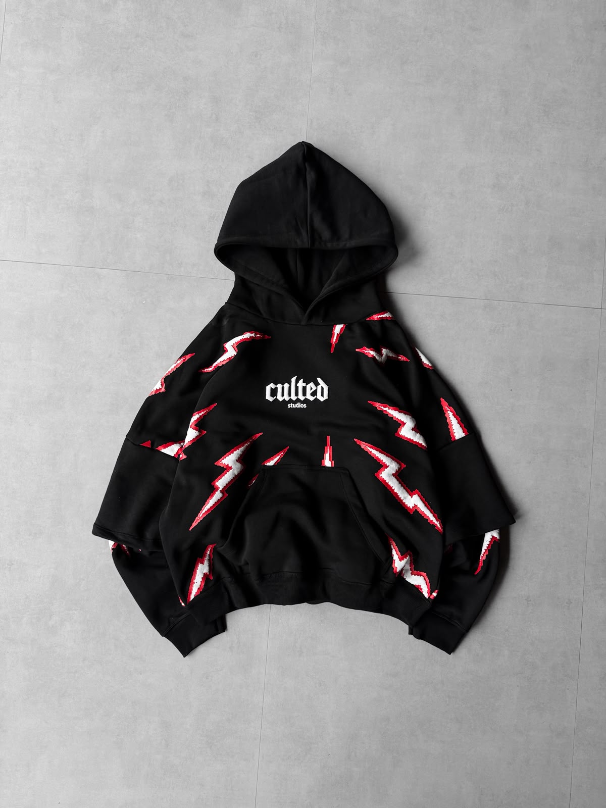 Black lightning puff-print oversized hoodie — detail
