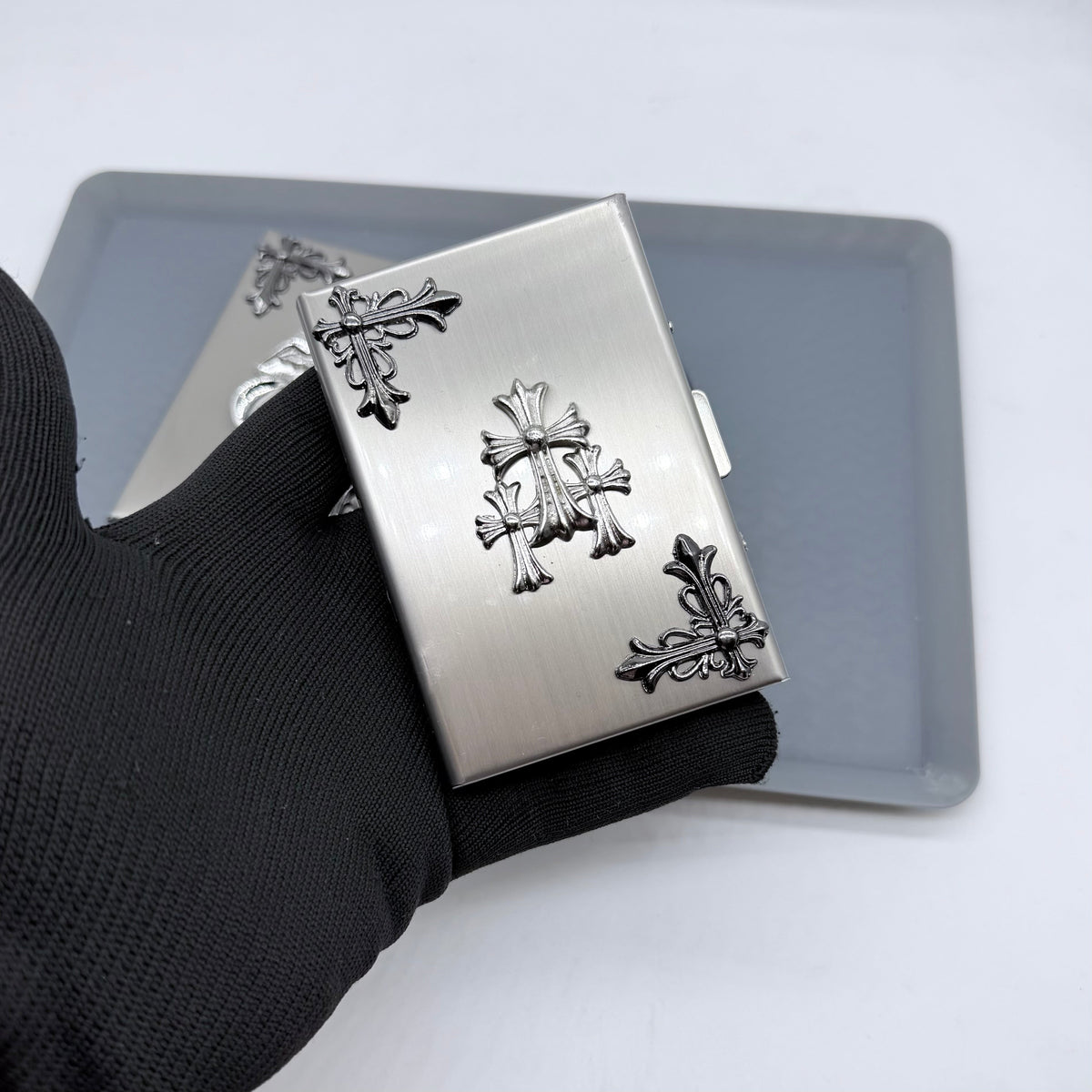 Brushed silver metal card holder with triple cast cross detailing