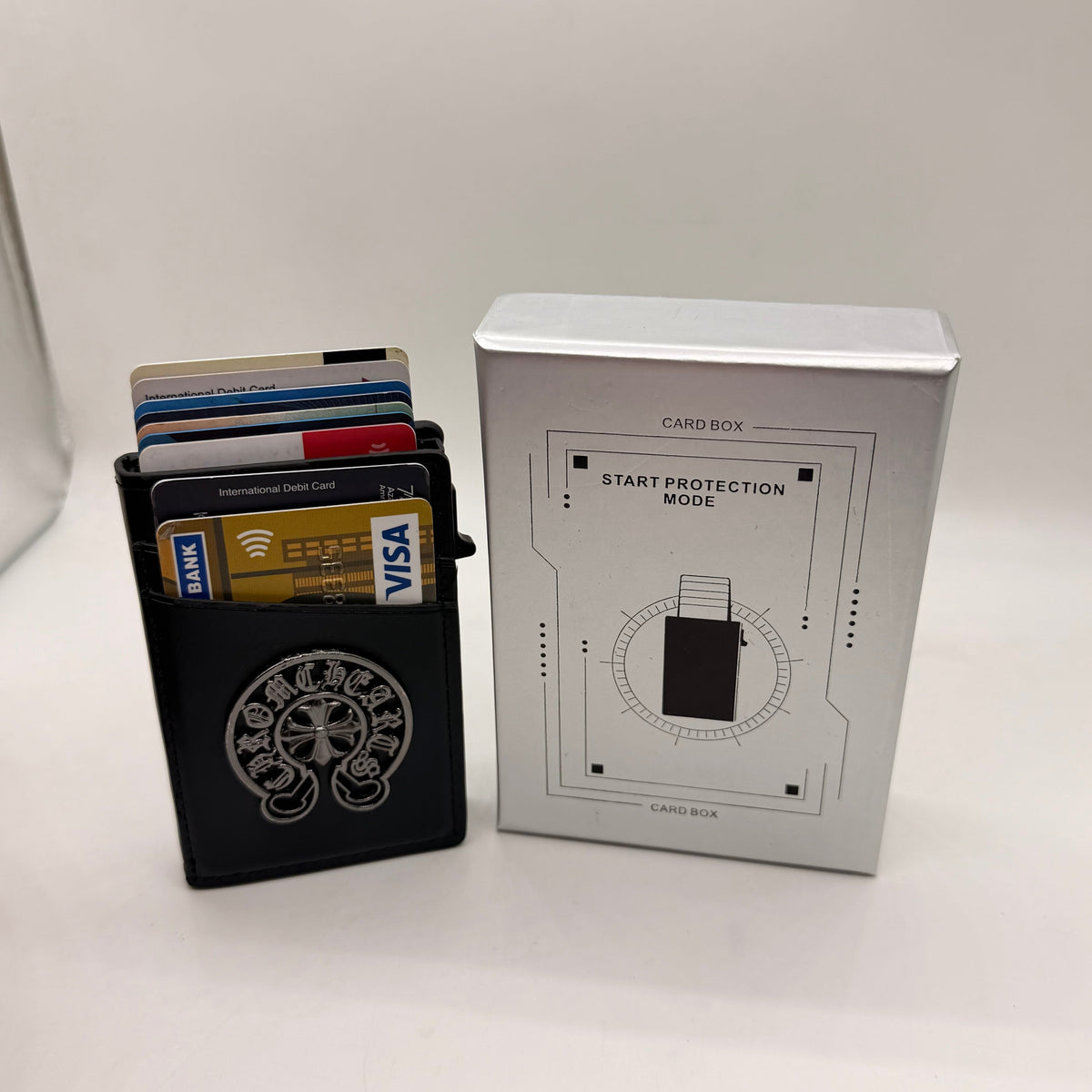 Slim chrome pop-up card wallet with leather cover
