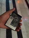 Chrome metal card case with etched reaper artwork