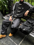 Striped suede bomber jacket in black - front